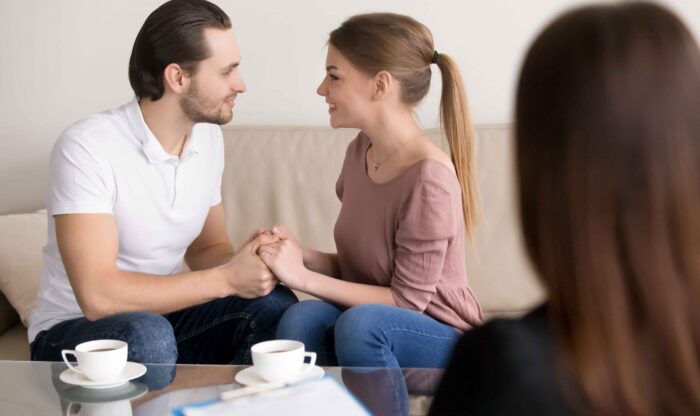 happy-smiling-young-couple-holding-hands-consulting-psychologist-planning-wedding (1) happy-smiling-young-couple-holding-hands-consulting-psychologist-planning-wedding (1)