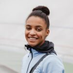 smiling-fit-young-african-sportswoman-carrying-spo-2021-08-27-18-29-01-utc